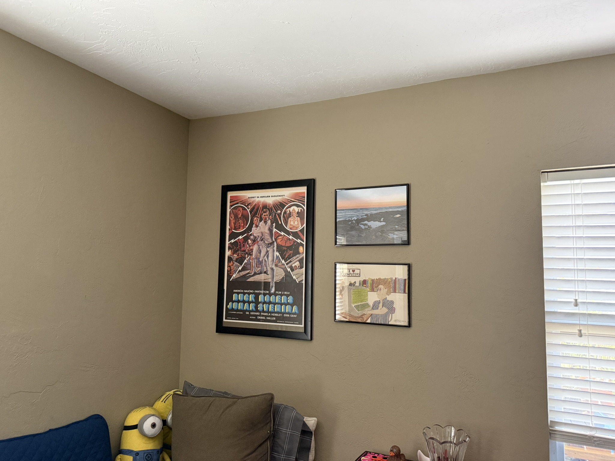 Gallery wall of framed art hung level